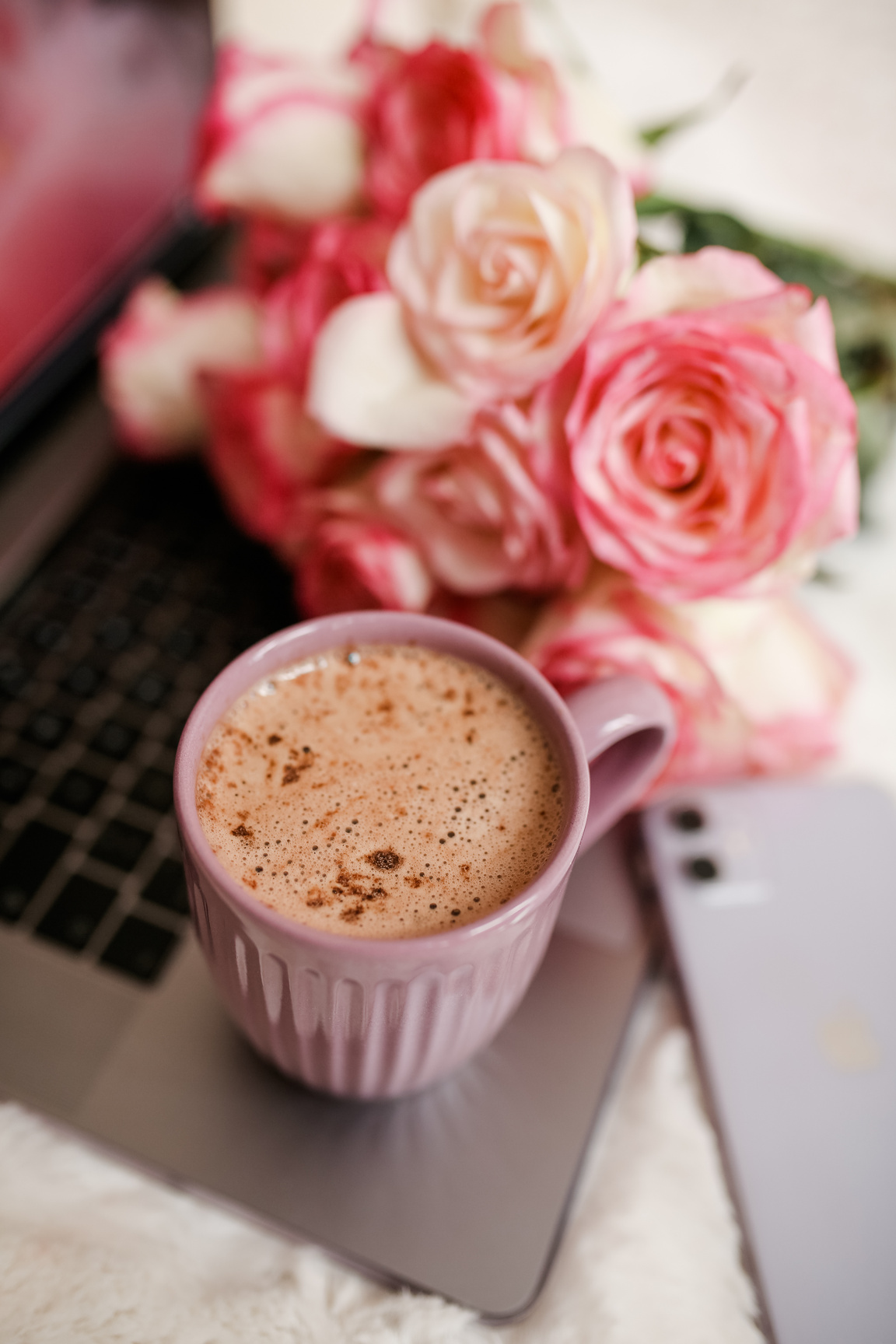 A Pink Ceramic Mug With Coffee